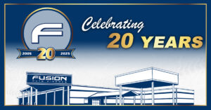 Fusion Auto Finance 20th Anniversary graphic featuring the Fusion logo, “Celebrating 20 Years” text, and an illustrated dealership building with years 2005–2025.